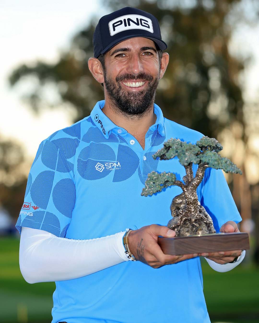 Farmers Insurance Open 2024 Champion Mattheiu Pavon with trophy made by Malcolm DeMille